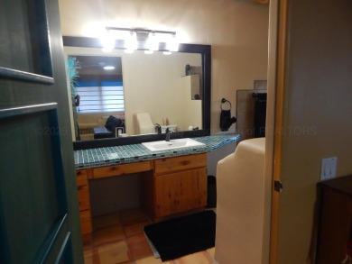 True Adobe style home in prestigious Alto Lakes Golf and Country