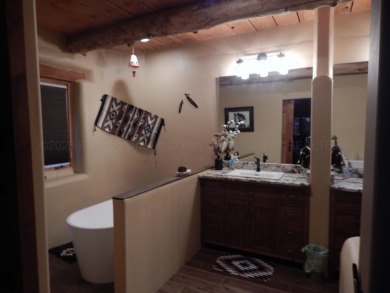 True Adobe style home in prestigious Alto Lakes Golf and Country