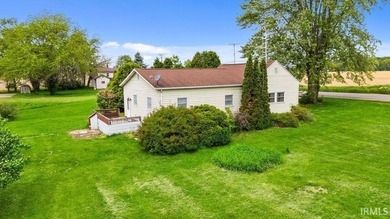 Situated on 1.28 acres in a country setting, this 3-bedroom - photo 2