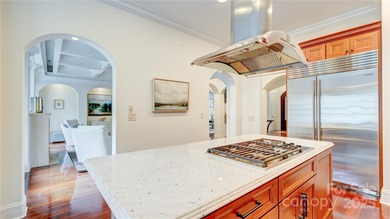 Enjoy luxurious gated living in this European inspired enclave