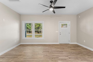 Custom-built 3 bedroom, 2 bath home situated on a spacious 1.5 - photo 3