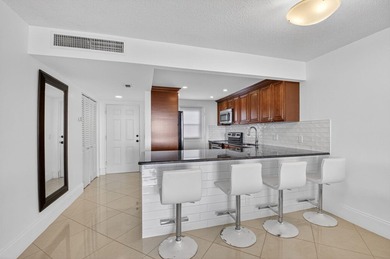 Pristine and fully updated, this penthouse-level 1-bedroom plus - photo 16