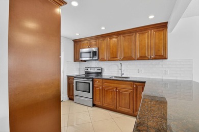Pristine and fully updated, this penthouse-level 1-bedroom plus - photo 17