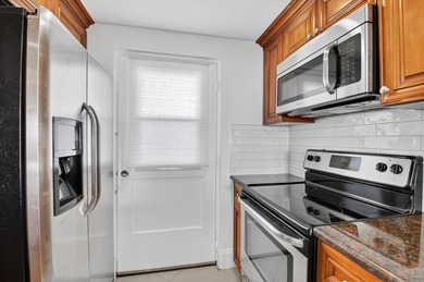 Pristine and fully updated, this penthouse-level 1-bedroom plus - photo 20