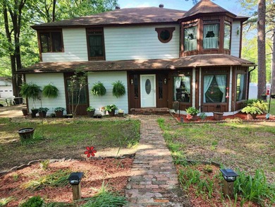 This enchanting Queen Anne-style home sits on 4.87 acres. The - photo 1