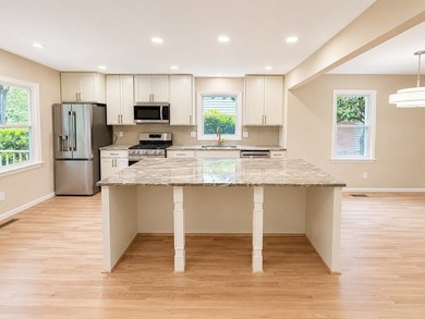 Completely reimagined from top to bottom, this stunning end-unit - photo 8