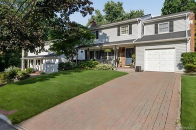 The brick driveway and lovely porch welcome you to this turnkey - photo 2