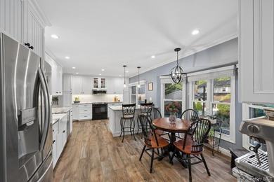 The brick driveway and lovely porch welcome you to this turnkey - photo 9