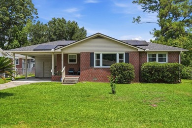 Welcome home to this charming brick residence nestled on a quiet - photo 1