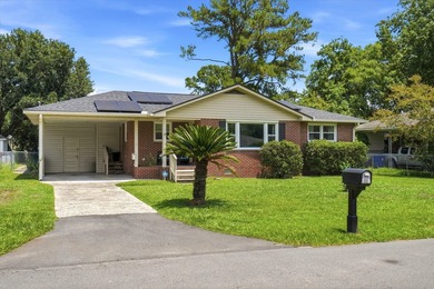 Welcome home to this charming brick residence nestled on a quiet - photo 2