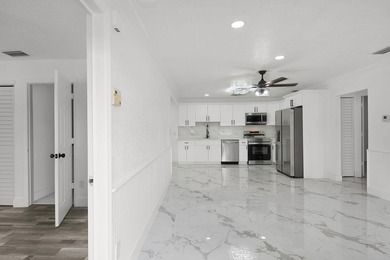 Fully renovated 3-bedroom, 2-bath home featuring a desirable - photo 8