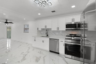 Fully renovated 3-bedroom, 2-bath home featuring a desirable - photo 9