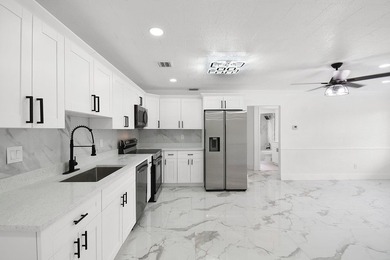 Fully renovated 3-bedroom, 2-bath home featuring a desirable - photo 10