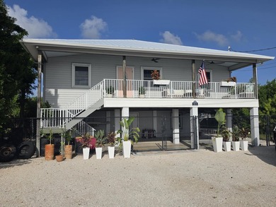 Elevated Coastal Living in Breezeswept Beach Estates. Skip the - photo 1