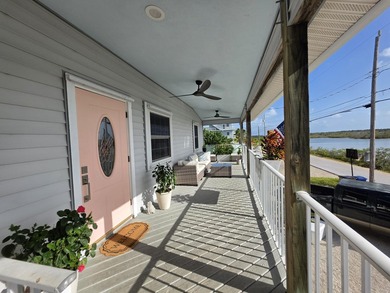 Elevated Coastal Living in Breezeswept Beach Estates. Skip the - photo 2