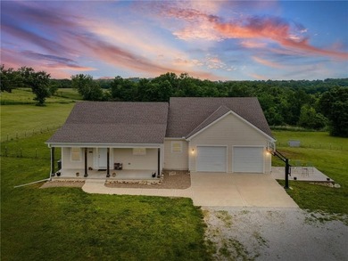 Perched atop 8+ acres, this beautiful reverse 1.5-story home - photo 1