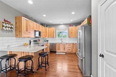 Perched atop 8+ acres, this beautiful reverse 1.5-story home - photo 6