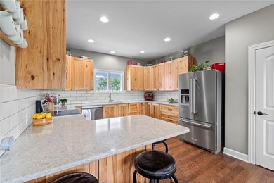 Perched atop 8+ acres, this beautiful reverse 1.5-story home - photo 7