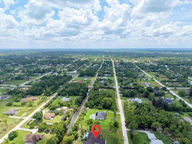 Welcome to your private oasis in the desirable Acreage area of - photo 48