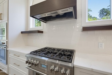 Custom built by award winning Bluestone Builders. Situated on a - photo 5