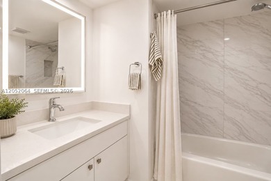 Welcome to this beautifully renovated first-floor condo in the - photo 12