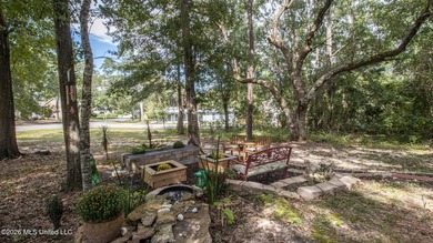 Located in the heart of Diamondhead, this spacious home sits on - photo 32