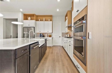 Experience luxury living in the beautiful , gated Bella Collina - photo 8