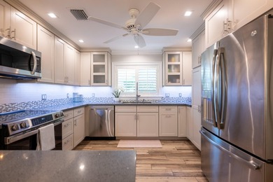 Island living is effortless in this exceptional 3-bedroom - photo 10