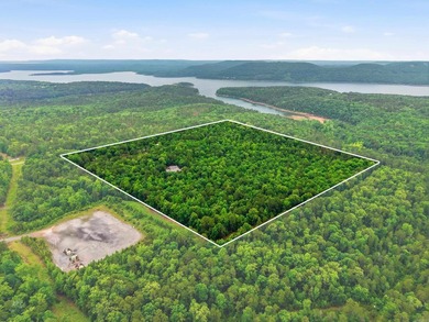 Tucked away in the Ozarks on 40 breathtaking acres, this - photo 2