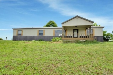 Looking for a spacious, affordable home in the country? This - photo 1