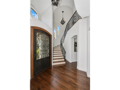 Nestled within the prestigious gated neighborhood of The - photo 3