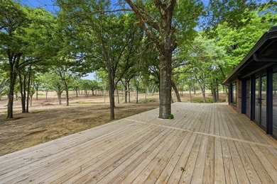 Set on 11 gently rolling acres in Sadler, TX, this beautifully - photo 32
