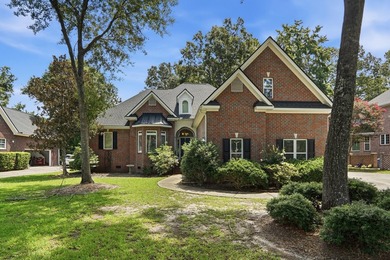 Set among mature trees on a quiet street, this brick traditional - photo 1