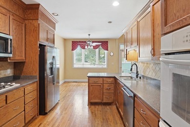 Set among mature trees on a quiet street, this brick traditional - photo 10