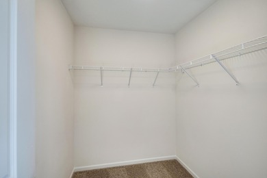 Enjoy the New Year in this move-in-ready end-unit Adler townhome