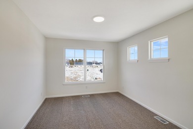 Enjoy the New Year in this move-in-ready end-unit Adler townhome
