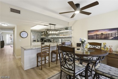 This impeccably updated 1,314-square-foot condo offers a rare - photo 3