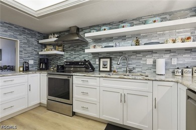 This impeccably updated 1,314-square-foot condo offers a rare - photo 7