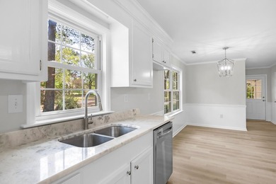 TOTALLY RENOVATED, ALL NEW KITCHEN, FRESH PAINT, NEW FLOORING - photo 11