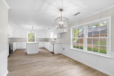 TOTALLY RENOVATED, ALL NEW KITCHEN, FRESH PAINT, NEW FLOORING - photo 12