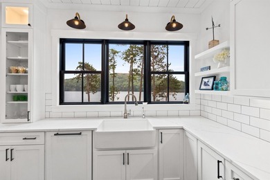 Set on nearly an acre with 201 feet of pristine Lake - photo 13