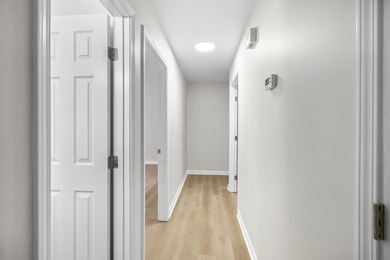 TOTALLY RENOVATED, ALL NEW KITCHEN, FRESH PAINT, NEW FLOORING - photo 21
