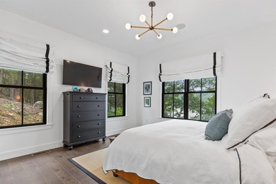 Set on nearly an acre with 201 feet of pristine Lake - photo 31