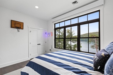 Set on nearly an acre with 201 feet of pristine Lake - photo 46