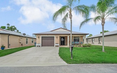 Charming home in Spanish Lakes One, a desirable 55+ community in - photo 1