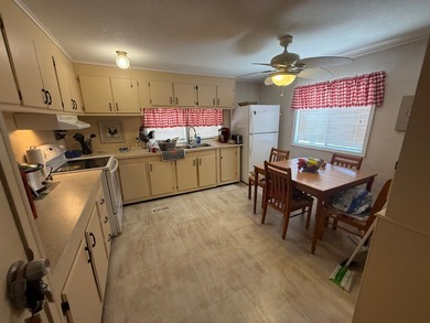 LOW LOT RENT $688 includes water,sewer,garbage. Partially - photo 11