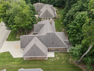 Well-maintained no-step home on a wooded cul-de-sac lot with