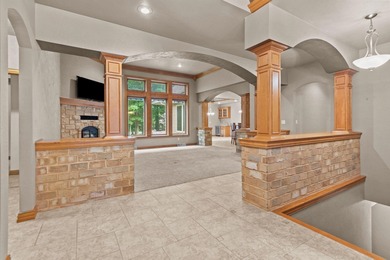 Well-maintained no-step home on a wooded cul-de-sac lot with