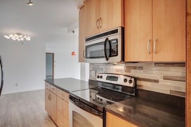 Experience the best of urban living in this sun-filled two