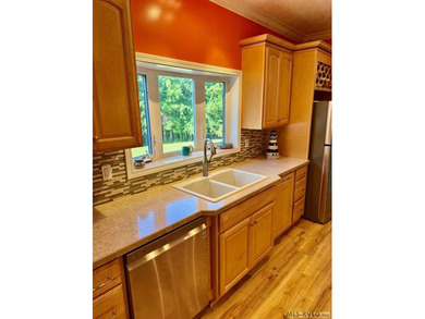 Own a beautiful LAKE House on 4.25 Acres with a gentle slope to - photo 12